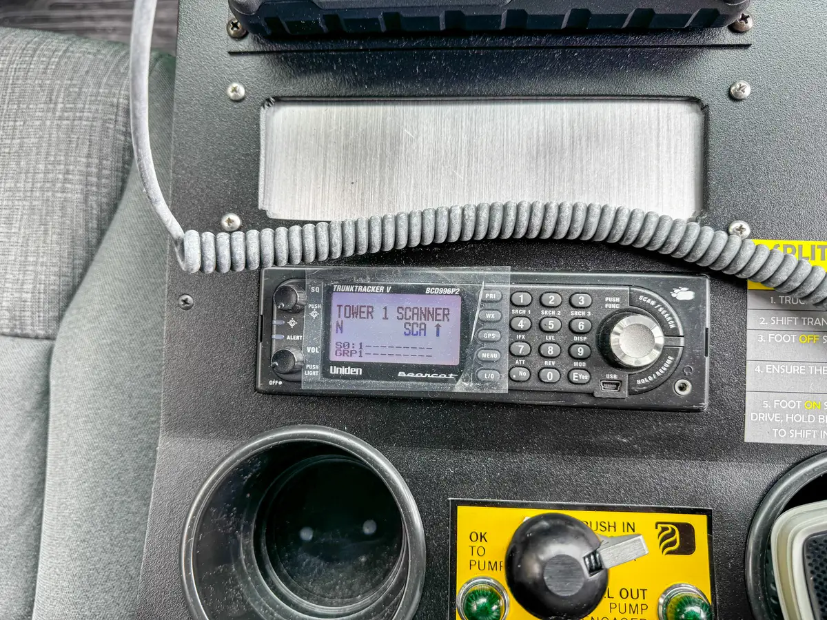 Rear driver-side door open exterior view into the crew cab.